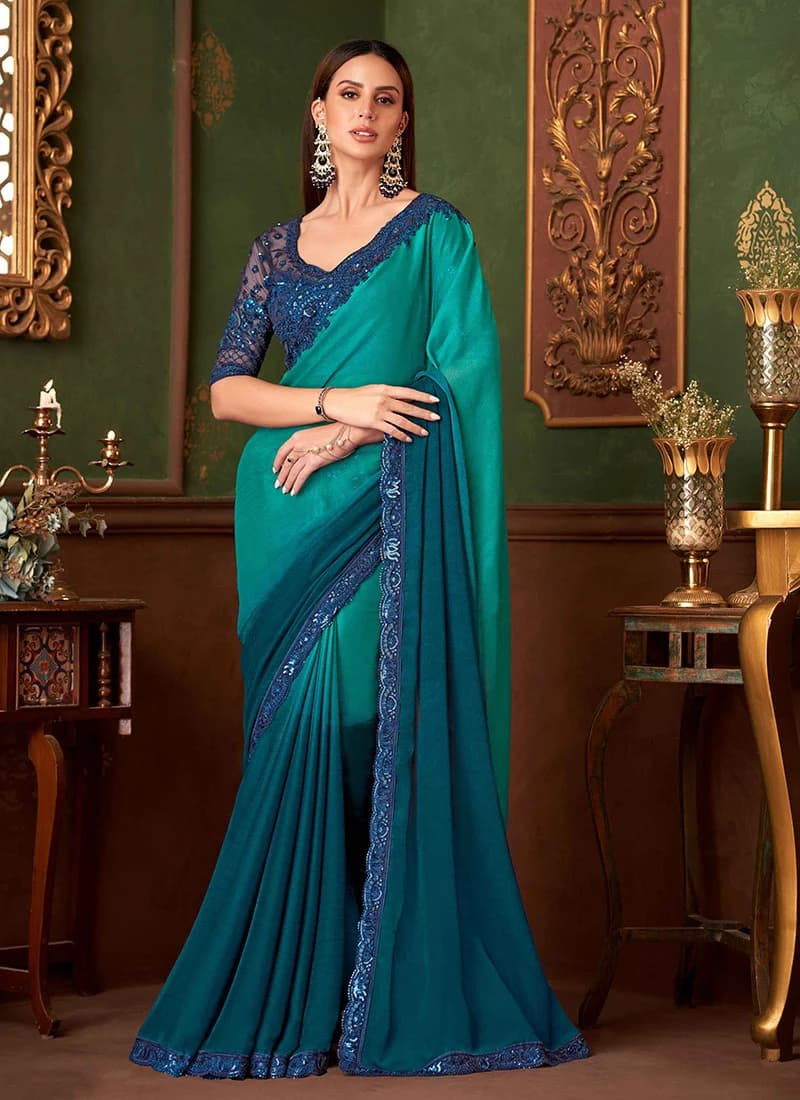 Model in a teal and blue chiffon saree