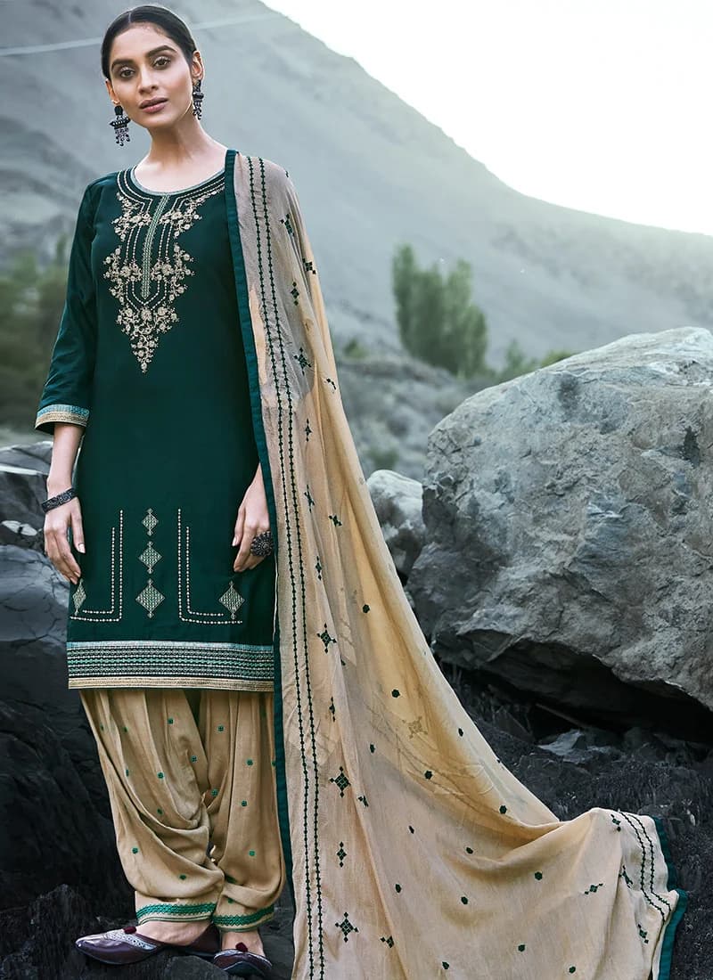 Model in a green patiala suit with dupatta
