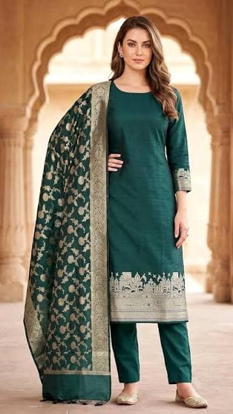 Model in a bottle-green suit with a banarasi dupatta
