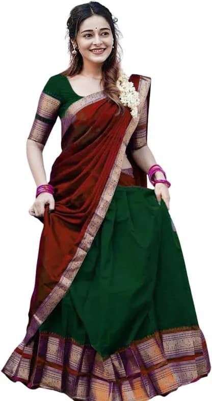 Model in a maroon and green pattu half saree