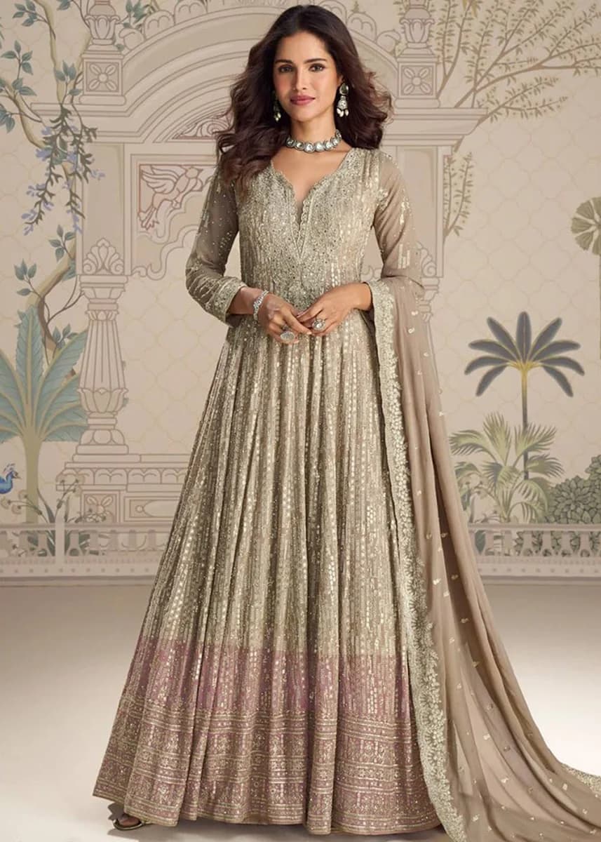 Model in a champagne-gold anarkali gown