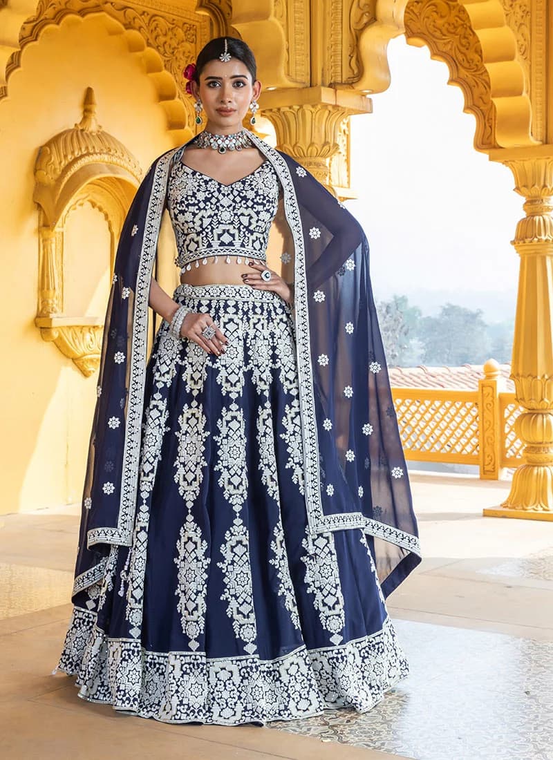 Model in a royal navy georgette lehenga with sequin embroidery