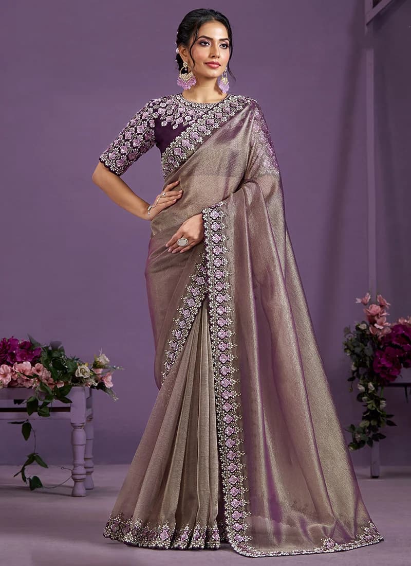 Model in a wine banarasi crush saree
